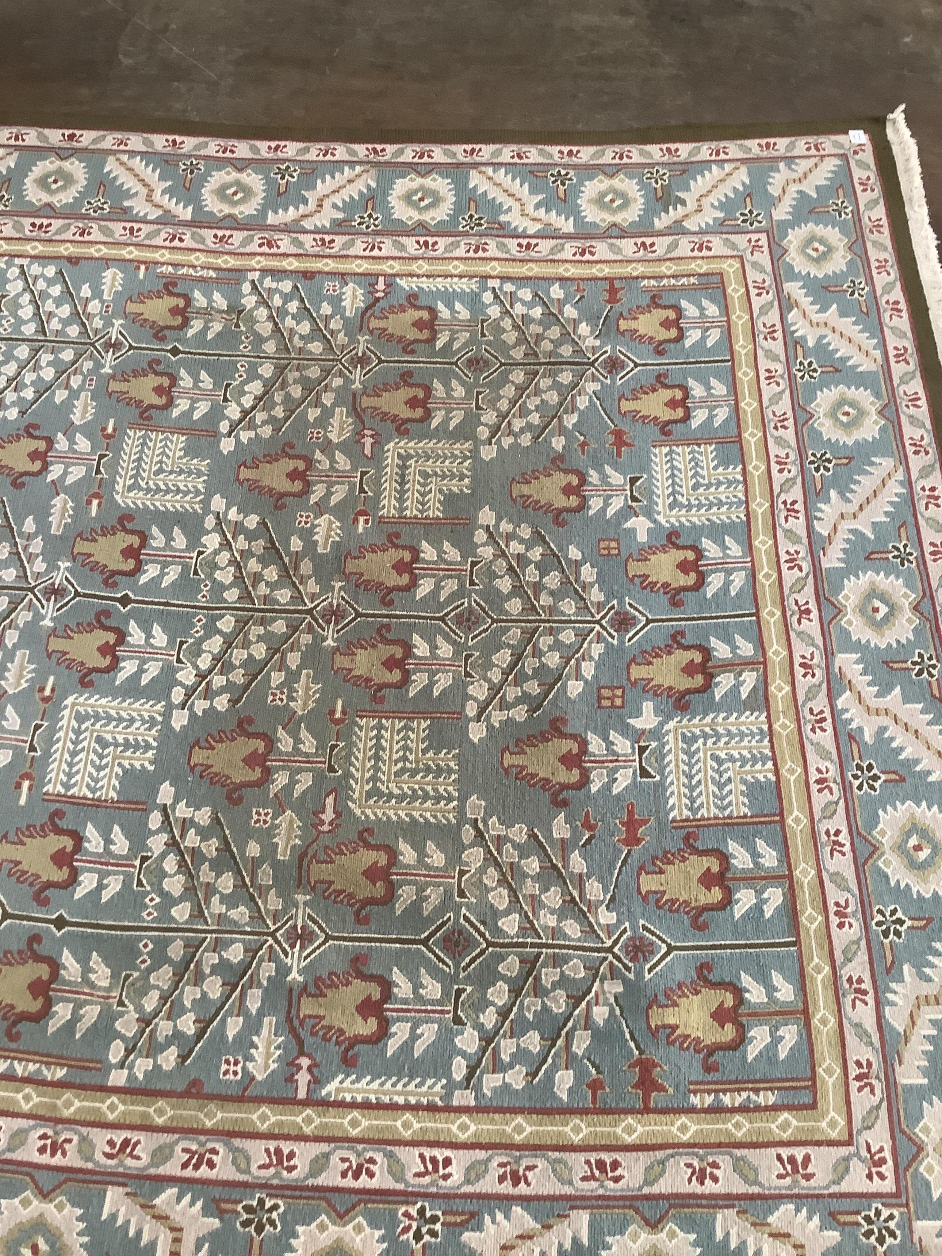 A modern Caucasian style pale blue ground carpet, 370 x 242cm. Condition - fair